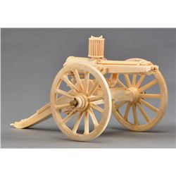 CARVED BONE SCALE MODEL GATLING GUN.