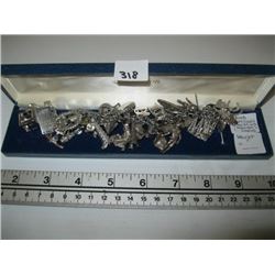 STERLING SILVER CHARM BRACELET WITH ASSORTED CHARMS