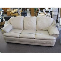 BEIGE LEATHER LOVESEAT (SOME PEN MARKS ON IT)