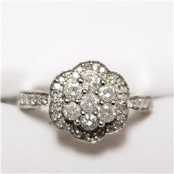 100) 10KT WHITE GOLD DIAMOND RING. SIZE 7