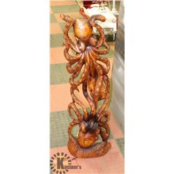 WOOD SCULPTURE OF 2 OCTAPUS FIGHTING OVER FISH