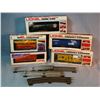 Image 1 : Lionel O gauge: 3 cabooses, tank car and box car, all NIB, and assorted used O gauge track