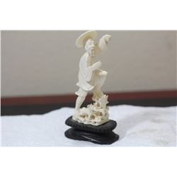 A Chinese Carved Bone Fisherman