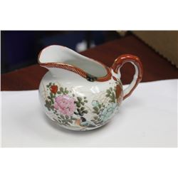 A Kutani Creamer
