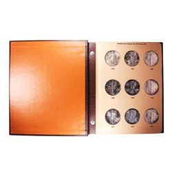 Lot of 1986-2010 $1 American Silver Eagle Coins in Book