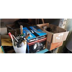 Box of mugs and onion soup dishes with utensils and spotlight