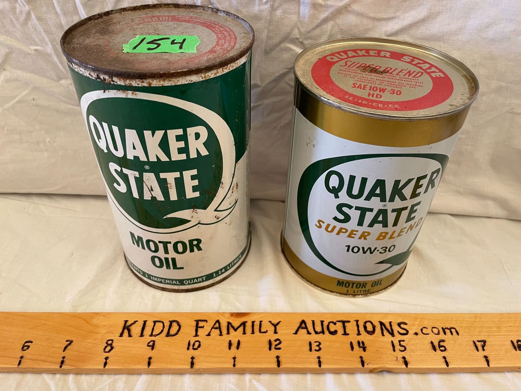 LOT OF 2 QUAKER STATE OIL CANS FULL Kidd Family Auctions