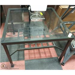 GLASS TOPPED TABLE,METAL TRIM + BOTTOM SHELF