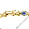 Image 6 : 14kt Yellow Gold 6.00 ctw Oval Iolite Puffed X & O Link Tennis Bracelet