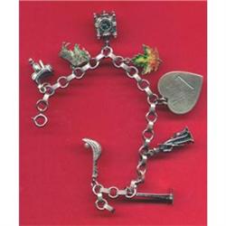 SILVER CHARM BRACELET WITH 8 CHARMS/WORLD TRA #1233573