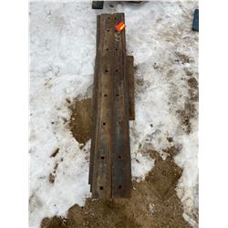 FT.MAC: LOT OF TWELVE 84" SKID STEER CUTTING EDGES