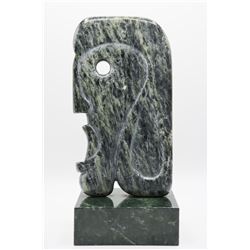 Strong Carving of a Stylized Head, Signed