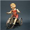 Image 1 : German tin wind-up toy; child riding tr