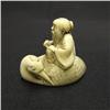 Image 1 : Carved ivory netsuke; old man with cran