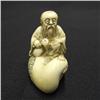 Image 2 : Carved ivory netsuke; old man with cran
