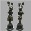 Image 2 : A pair of bronze figural candleholders;