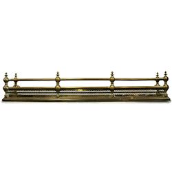 Brass fireplace fender; round hollow gu