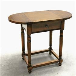 Walnut one drawer stand; oval top over 