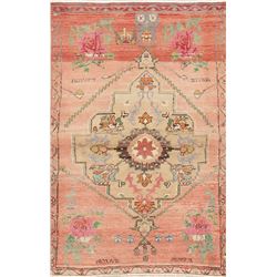 A WOOL HAND KNOTTED OUSHAK ORIENTAL AREA RUG.