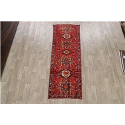 A WOOL HAND KNOTTED ORIENTAL RUG RUNNER.