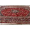 Image 9 : A WOOL HAND KNOTTED FLORAL ORIENTAL AREA RUG.