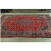 Image 9 : A WOOL HAND KNOTTED FLORAL MEDALLION AREA RUG.