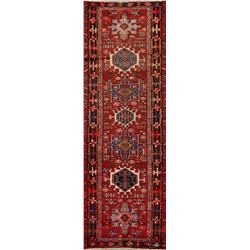 A WOOL HAND KNOTTED ORIENTAL RUG RUNNER.