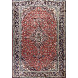 A WOOL HAND KNOTTED FLORAL ORIENTAL AREA RUG.