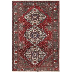 A WOOL HAND KNOTTED MEDALLION AREA RUG.