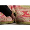 Image 12 : A WOOL HAND KNOTTED OUSHAK AREA RUG.