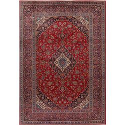 A WOOL HAND KNOTTED MEDALLION AREA RUG.