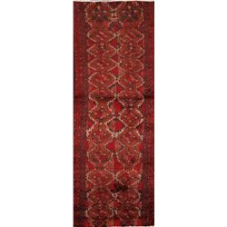 A WOOL HAND KNOTTED BALOUCH ORIENTAL RUG RUNNER.
