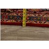 Image 11 : A WOOL HAND KNOTTED FLORAL MEDALLION AREA RUG.