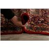 Image 12 : A WOOL HAND KNOTTED FLORAL MEDALLION AREA RUG.