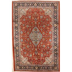 A WOOL HAND KNOTTED FLORAL ORIENTAL AREA RUG.