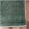 Image 5 : A WOOL HAND KNOTTED FLORAL AREA RUG.
