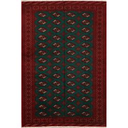 A WOOL HAND KNOTTED TURKOMAN ORIENTAL AREA RUG.