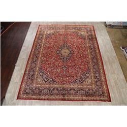 A WOOL HAND KNOTTED FLORAL ORIENTAL AREA RUG.