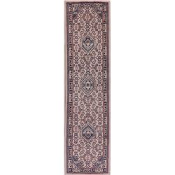 A WOOL HAND KNOTTED ORIENTAL RUG RUNNER.