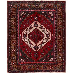A WOOL HAND KNOTTED MEDALLION ORIENTAL AREA RUG.