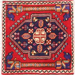 A WOOL HAND KNOTTED SQUARE ORIENTAL RUG.
