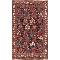 A WOOL HAND KNOTTED KAZAK ORIENTAL AREA RUG.