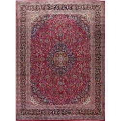 A WOOL HAND KNOTTED FLORAL KASHMAR AREA RUG.
