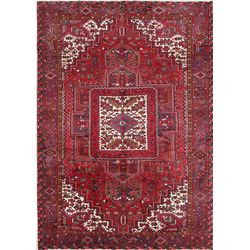 A WOOL HAND KNOTTED ORIENTAL AREA RUG.