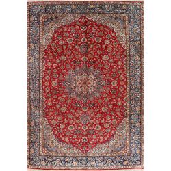 A WOOL HAND KNOTTED FLORAL ORIENTAL AREA RUG.