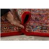Image 12 : A WOOL HAND KNOTTED FLORAL ORIENTAL AREA RUG.