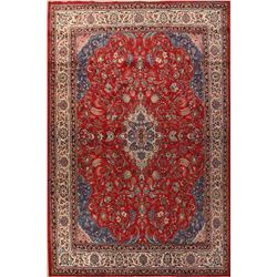 A WOOL HAND KNOTTED FLORAL ORIENTAL AREA RUG.