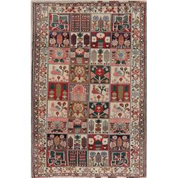A WOOL HAND KNOTTED ORIENTAL AREA RUG.