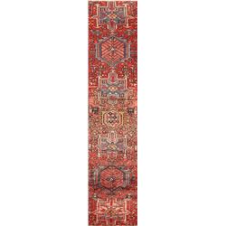 A WOOL HAND KNOTTED GHARAJEH RUG RUNNER.