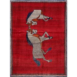 A WOOL HAND KNOTTED PICTORIAL AREA RUG.